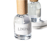 Vente en gros 30ml50ml100ml Flacon de parfum rond en verre transparent dépoli avec bouchon en bois