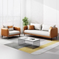 Ensemble de canapés en cuir PU bicolore gris caramel avec accoudoirs incurvés et pieds métalliques coniques, idéal pour le bureau et la réception