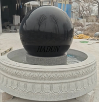 Fontaine à eau flottante en pierre noire naturelle sculptée à la main pour jardin extérieur