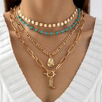 Bijoux transfrontaliers : Pendentif botte de cowboy bohème western, collier turquoise, forme en Y à plusieurs rangs avec pompons superposés