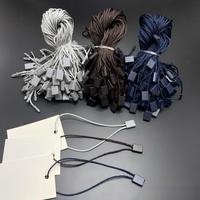 En gros, attaches pour étiquettes volantes de vêtements en polyester, avec cordon, fermeture plastique et boucle pour étiquette volante