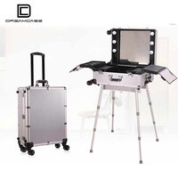 Valise de maquillage portable DreamCase, prix d'usine, boîte à maquillage rotative avec lumières LED et pieds