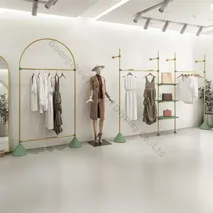 服装店室内设计女士精品服装店装饰定制木质金属支架展示零售服装店