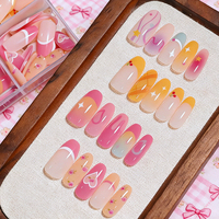 120 faux ongles à presser, boîte à 4 compartiments, forme amande moyenne, rose doux et jaune, motifs cerise, cœur et floral, pré-dessinés