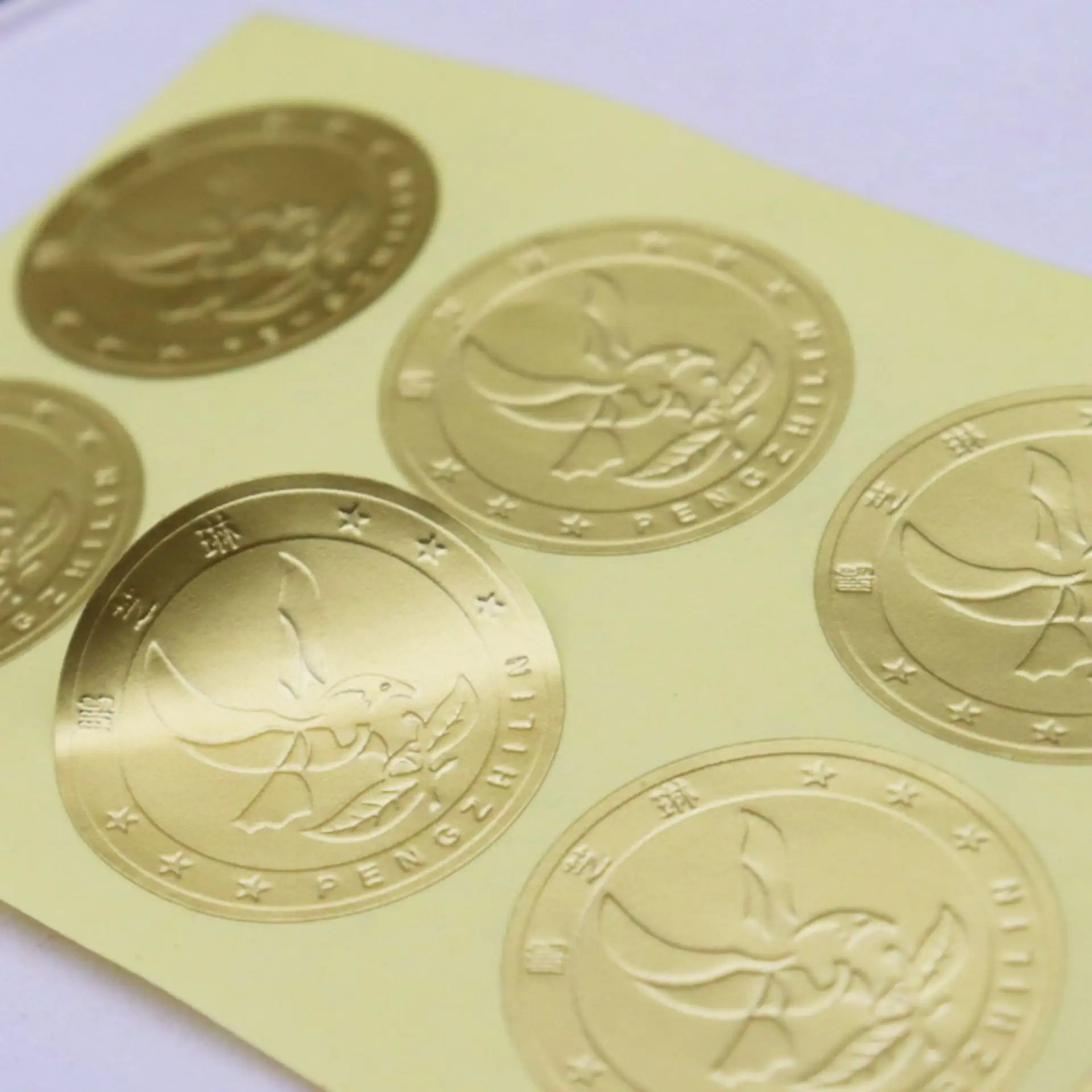 Custom Logo Embossed Label Printing Seal Gold Foil Sticker Textured Paper Adhesive Brand Logo Sticker