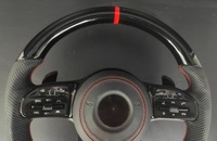Volant sport pour Mercedes Classe G W464 en cuir noir brillant avec surpiqûres rouges et fibre de carbone pour 3/4 branches, montage direct