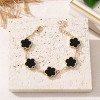 Pulsera Compacta de Aleación Bicolor Negro y Marrón con Diseño de Trébol de Cinco Hojas, Moderna y Clásica para Mujer