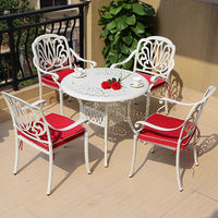 Ensemble de table et de chaises de jardin en aluminium coulé moderne avec design imperméable et résistant au soleil pour terrasse et cour