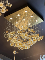 Lustre suspendu moderne sur mesure en verre et cristal de luxe, grand décor en pierre ambrée pour salon, hôtel, villa, maison, escalier