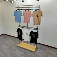 Présentoirs de Vêtements Dorés en Acier Chromé pour Magasins de Vêtements Personnalisés – Portants et Étagères Dorés pour Présentation de Vêtements