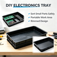 Plateau en plastique robuste empilable et antistatique pour le stockage de composants sensibles, idéal pour atelier de réparation électronique et bureau.