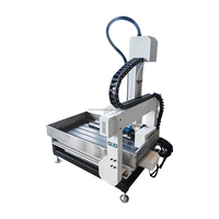 Nouvelle machine de gravure et de fraisage CNC multifonctionnelle de bureau 6090 à 4 axes avec changement automatique d'outils pour cylindres plats
