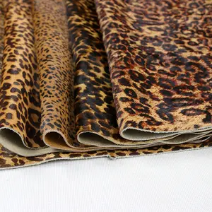 Material de cuero con estampado de guepardo de piel de vaca genuina con textura de leopardo negro para hacer bolsos y zapatos