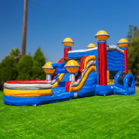 Château gonflable commercial avec toboggan aquatique pour location événementielle
