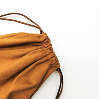 Pochette OEM à fond rond en faux daim de qualité supérieure avec cordon de serrage, durable pour le rangement d'appareils de beauté et la présentation en magasin