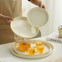 Plateau rond en céramique, plateau à eau et à thé pour la maison, plateau de service esthétique haut de gamme pour hôtel, rangement de collations et de nourriture