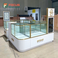 Vitrine de comptoir en verre sur mesure pour la vente au détail, cadre doré, corps blanc, coin arrondi, vitrine de boutique