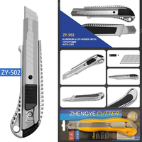 Cutter robuste 18 mm à lame cassable en acier à haute teneur en carbone, manche en alliage d'aluminium et TPE, logo personnalisé OEM