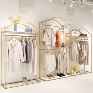 Espositore per <span class=keywords><strong>Abbigliamento</strong></span> a Doppio Strato con Scaffali in Ferro Dorato e Asta Appendiabiti per <span class=keywords><strong>Negozi</strong></span> <span class=keywords><strong>di</strong></span> <span class=keywords><strong>Abbigliamento</strong></span> <span class=keywords><strong>Femminile</strong></span> - Product Image 1