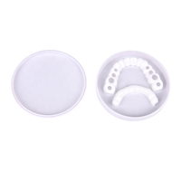Dentier couverture en silicone plastique blanchir les dents dentaires supérieure inférieure fausses dents couverture snap sur les facettes dentaires