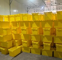 Guanyu Vente en gros Caisse en plastique empilable à couvercle attaché robuste Boîte fourre-tout en plastique emboîtable et bac en plastique pour déménagement