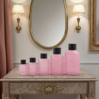 Fuyun Bouteille en verre pour soins de la peau en petite quantité 15ml/30ml/60ml/125ml/200ml Bouchon à vis noir en forme de cylindre rose mat pour l'utilisation de tampons