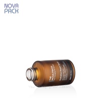 Emballage de flacon de sérum de 30ml 50ml 60ml Flacon compte-gouttes en verre ambré à bouton-poussoir Flacon d'huile facial à épaule plate