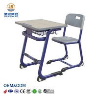 Ensemble de bureau et de chaise d'étudiant moderne, durable et confortable en bois et en plastique avec plateau en MDF et cadre en acier pour le lycée
