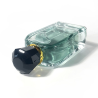 Bouteille en verre de luxe de forme unique de haute qualité 100ml emballage d'huile essentielle de vaporisateur de brouillard vide transparent bouteille de parfum vide