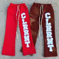 Pantalon cargo évasé délavé à l'acide, style streetwear décontracté, avec appliqué graphique et patch brodé lettres, coupe évasée superposée