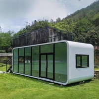 Cabines de bureau mobiles préfabriquées modernes de 20 pieds et 40 pieds, panneaux sandwich en acier, mini-maisons, chambre, salle de bain, cuisine pour villa, école