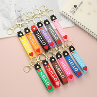 Porte-clés en caoutchouc souple PVC en forme de cœur, avec cordon en cuir, pour sacs, pendentifs décoratifs, mignons et très demandés