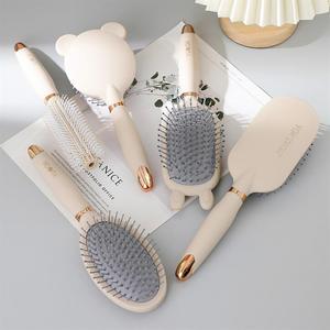 Brosse à cheveux élégante bleue avec coussin d'air, en ABS, nylon et caoutchouc, avec nettoyeur - Product Image 1