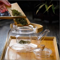 Théière en verre résistant à la chaleur avec poignée en bambou faite à la main en verre à haute teneur en borosilicate avec passoire en verre 900ml