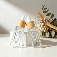 Vente en gros de flacons compte-gouttes en verre épais de luxe de 5 ml, flacons vides pour sérum avec col en bambou pour les soins de la peau, les parfums et les huiles essentielles
