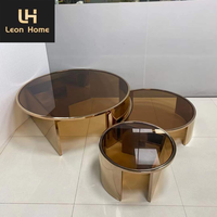 Table basse de luxe minimaliste en verre transparent ronde et moderne pieds en acier inoxydable