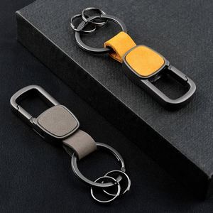 Llavero de coche de lujo ligero de cuero genuino con hebilla metálica para colgar en la cintura, con letras grabadas, para hombre y mujer - Product Image 2