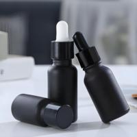 Flacon d'huile essentielle en verre Boston avec logo personnalisé, 1 oz, 2 oz, 50 ml, 100 ml, emballage de luxe noir pour huile capillaire avec compte-gouttes