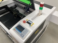 Máquina de grabado corte láser de CO2 Tounjen 7050 con refrigeración por agua control Ruida para acrílico madera papel piedra