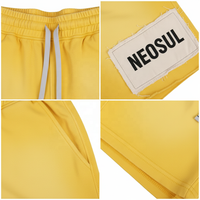 Shorts jaunes coupés-cousus personnalisés style urbain 300 grammes avec poches brodées cordon de serrage lavé uni 100% coton tricoté coupe-vent pour homme