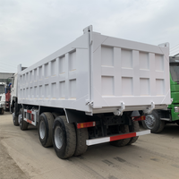 Prix d'usine SINOTRUK HOWO NX 8x4 Camion benne d'occasion 12 roues pour l'Afrique pour le transport de sable et de gravier