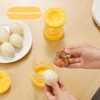 Nouveaux gadgets de cuisine séparateur de coquille d'oeuf rotatif accessoire décapant d'oeuf en plastique éplucheur fendu glisser hors de sa coquille