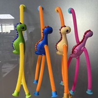 Jouet de soulagement du stress en plastique à ventouse, tube télescopique polyvalent, dinosaure de dessin animé, nouveauté