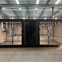 Maison préfabriquée compacte en Australie à vendre, maison conteneur extensible de 20 pieds à toit plat avec mur en verre et salle de bain