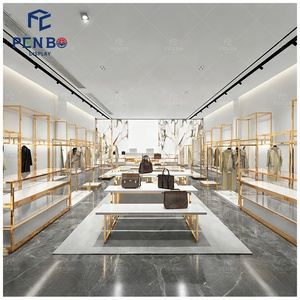 Exhibidores de Ropa de Alta Gama Personalizados para Tiendas de Zapatos, Bolsos y Ropa, Diseño Interior Dorado, Estantes para Exhibición de Vestidos de Mujer - Product Image 1