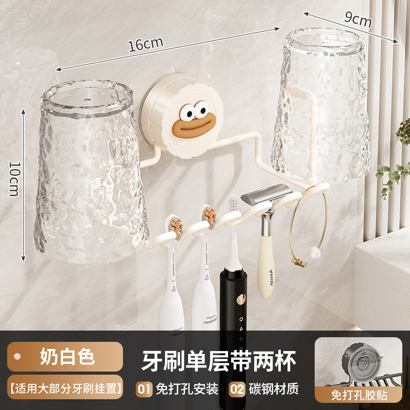 La brosse à dents est dotée d'une seule couche et est livrée avec deux gobelets de couleur blanc laiteux.