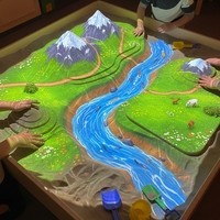 Jeu interactif de table de sable 3D avec projection et réalité augmentée, équipé d'un projecteur