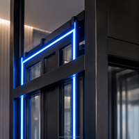 Porte battante manuelle de luxe en acier inoxydable noir brossé titane avec panneau d'appel dissimulé pour ascenseur de villa