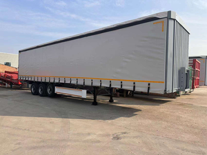 Remolque de Tres Ejes y 60 Toneladas con Cortina Deslizante de PVC para el Transporte de Bebidas y Vegetales - Product Image 4