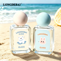 Botol Parfum Kaca Mini Murah Pabrik 30ml 50ml 100ml Botol Parfum Bulat Transparan Kosong dengan Pompa Semprot dan Tutup Bola Berwarna